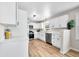 Bright, modern kitchen with stainless steel appliances and white cabinetry at 3027 Griffa Ave, Columbus, IN 47203