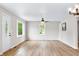 Open-concept living space with new flooring and ample natural light at 3027 Griffa Ave, Columbus, IN 47203