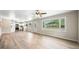 Sunlit living room features new floors and a large window with an outside view at 3027 Griffa Ave, Columbus, IN 47203
