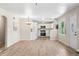 Bright living room flows into modern white kitchen with stainless steel appliances at 3027 Griffa Ave, Columbus, IN 47203