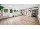 Sunroom features stone wall, bright windows, and vinyl flooring at 3027 Griffa Ave, Columbus, IN 47203