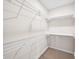 Walk-in closet featuring wire shelving and neutral carpet at 3027 Griffa Ave, Columbus, IN 47203