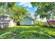 Backyard view with green grass, shed, and trees at 3109 E St Joseph St, Indianapolis, IN 46201