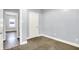 Bedroom with fresh paint, neutral carpet and two white doors at 3109 E St Joseph St, Indianapolis, IN 46201