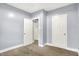Bedroom with fresh paint, neutral carpet and two white doors at 3109 E St Joseph St, Indianapolis, IN 46201