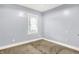 Bright bedroom with a window and neutral carpet at 3109 E St Joseph St, Indianapolis, IN 46201