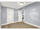 A cozy bedroom with soft carpet and a door leading to other rooms at 3109 E St Joseph St, Indianapolis, IN 46201