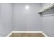 Empty walk-in closet with neutral gray walls and carpet flooring at 3109 E St Joseph St, Indianapolis, IN 46201