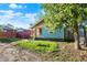 Charming single-story home with blue siding and wood shingle accents; great curb appeal at 3109 E St Joseph St, Indianapolis, IN 46201