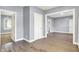 Open living room with light gray walls and wood-look flooring at 3109 E St Joseph St, Indianapolis, IN 46201
