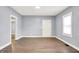 Bright living room features new floors, fresh paint, and ample natural light at 3109 E St Joseph St, Indianapolis, IN 46201