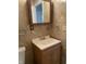 Cozy bathroom featuring a vanity with storage and framed mirror at 3208 Wellington Ave, Indianapolis, IN 46226