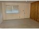 Bedroom featuring a window, closet, and plank floors at 3208 Wellington Ave, Indianapolis, IN 46226
