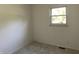 Neutral bedroom featuring carpeted floors and a window at 3208 Wellington Ave, Indianapolis, IN 46226