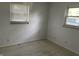 Bedroom with windows providing natural light and laminate floors at 3208 Wellington Ave, Indianapolis, IN 46226