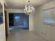 Dining room featuring a chandelier, a window, and plank floors at 3208 Wellington Ave, Indianapolis, IN 46226