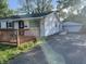 Charming home featuring a wooden deck and a detached garage at 3208 Wellington Ave, Indianapolis, IN 46226