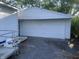 A side view of a white garage attached to the home at 3208 Wellington Ave, Indianapolis, IN 46226