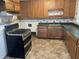 Traditional kitchen with wooden cabinets and modern gas range at 3208 Wellington Ave, Indianapolis, IN 46226