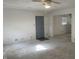 Carpeted living room with a ceiling fan and doorways at 3208 Wellington Ave, Indianapolis, IN 46226