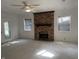 Bright living room featuring a brick fireplace and large windows at 3208 Wellington Ave, Indianapolis, IN 46226