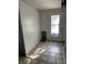 Mudroom featuring tile floors and an exterior door at 3208 Wellington Ave, Indianapolis, IN 46226