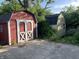 View of two sheds outside the home. One shed is red and the other is an off-white color at 3208 Wellington Ave, Indianapolis, IN 46226