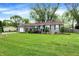 Cute ranch style home with a green lawn at 3552 N Talley Rd, Columbus, IN 47203