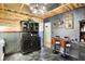 Unique kitchen featuring mixed materials, an antique cabinet, bar seating, and a modern light fixture at 3552 N Talley Rd, Columbus, IN 47203