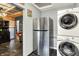 Open concept kitchen featuring stainless steel appliances and adjoins the laundry area at 3552 N Talley Rd, Columbus, IN 47203
