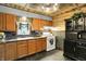 Kitchen with wooden cabinets and a white oven at 3552 N Talley Rd, Columbus, IN 47203