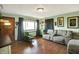 Cozy living room with a sofa and a green arm chair at 3552 N Talley Rd, Columbus, IN 47203