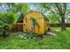 Exterior view of a backyard wooden shed with green trim at 3552 N Talley Rd, Columbus, IN 47203