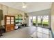 Bright sunroom with access to the backyard through sliding glass doors and storage at 3552 N Talley Rd, Columbus, IN 47203