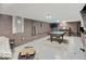 Finished basement with a pool table, bar area, and exposed brick at 3659 Watson Rd, Indianapolis, IN 46205