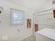 Bright bathroom with a glass-enclosed shower, white vanity, and tiled floor at 3659 Watson Rd, Indianapolis, IN 46205