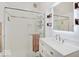 Bright bathroom with glass-enclosed shower, white subway tile, and modern vanity at 3659 Watson Rd, Indianapolis, IN 46205