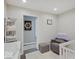 Neutral Bedroom design with comfortable chair, side table, and natural light at 3659 Watson Rd, Indianapolis, IN 46205