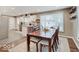 Dining room with large wooden table adjacent to the kitchen area at 3659 Watson Rd, Indianapolis, IN 46205
