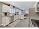 Modern kitchen with white cabinets, granite countertops, and stainless steel appliances at 3659 Watson Rd, Indianapolis, IN 46205