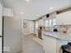 A bright kitchen with granite countertops, stainless steel appliances, and white cabinetry at 3659 Watson Rd, Indianapolis, IN 46205