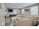 Open living room featuring a large sectional sofa, hardwood floors, a fireplace and plenty of natural light at 3659 Watson Rd, Indianapolis, IN 46205