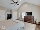 Main bedroom showcasing vaulted ceiling, closet, television, and dresser at 3659 Watson Rd, Indianapolis, IN 46205