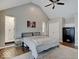 Primary bedroom with vaulted ceilings, dark wood floors and a large bed at 3659 Watson Rd, Indianapolis, IN 46205