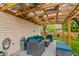 Backyard deck with comfortable seating and a view of the green backyard and trees at 3754 Smallwood W Ln, Indianapolis, IN 46214