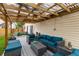 Backyard deck with seating, view of the house and backyard, and a wood-framed pergola at 3754 Smallwood W Ln, Indianapolis, IN 46214