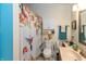Updated bathroom with floral shower curtain, sink and vanity at 3754 Smallwood W Ln, Indianapolis, IN 46214
