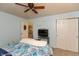 Cozy bedroom with ceiling fan, TV, and closet for optimal comfort and storage at 3754 Smallwood W Ln, Indianapolis, IN 46214