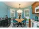 Eat-in kitchen featuring a round table, bright light fixture, and cabinets for storage at 3754 Smallwood W Ln, Indianapolis, IN 46214