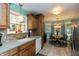 Functional kitchen featuring sleek counter-tops, modern appliances, and a sunlit breakfast nook at 3754 Smallwood W Ln, Indianapolis, IN 46214